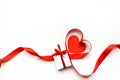 Top view of ribbon shaped as heart and gift box on white background. Valentine`s day concept.