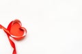 Top view of ribbon shaped as heart on white background. Valentine`s day concept