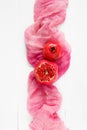 Top view of a ripe pomegranate on a pink fabric. Food Fashion minimal style. Only pomegranate