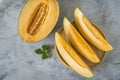 Top view. Ripe yellow watermelon cut in half and sliced on a plate. Royalty Free Stock Photo