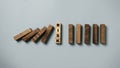 Top view of risk wording on wooden cube block stop wooden falling domino for risk analysis assessment and management concept Royalty Free Stock Photo