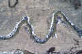 Top view of river running through bare farmland