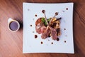 Top view of Roasted Australian lamb rack served with ratatouille and country potato Royalty Free Stock Photo