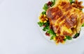 Top view roasted chicken on plate with salad and figs on white isolated background Royalty Free Stock Photo