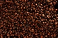 Top view of roasted coffee beans for background and texture. Piled of roasted coffee beans can be used as a background