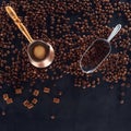 Roasted coffee beans, scoop and coffee pot on black Royalty Free Stock Photo