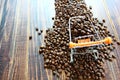 Top view roasted coffee beans on small shopping cart  on coffee beans on retro wood floor , copy space Royalty Free Stock Photo