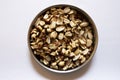 Top view of roasted unsalted peanuts in plate Royalty Free Stock Photo