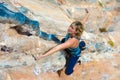 Top View of Rock Climber on orange Vertical Wall Royalty Free Stock Photo