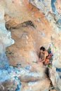 Top View of Rock Climber on orange Vertical Wall Royalty Free Stock Photo