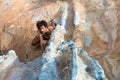 Top View of Rock Climber on orange Vertical Wall Royalty Free Stock Photo