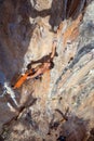 Top View of Rock Climber on orange Vertical Wall Royalty Free Stock Photo