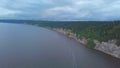 Top view of rocky shore of lake with forest. Clip. Panorama of lake with rocky shore on background of green forest and Royalty Free Stock Photo