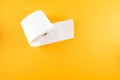 Top view of roll of toilet paper on orange background Royalty Free Stock Photo