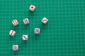 Top view rolling dice on green cutting mat .