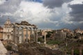 Top view of the Roman Forum against a dramatic sky. Ancient architecture and the urban landscape of historical Rome Royalty Free Stock Photo