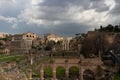 Top view of the Roman Forum against a dramatic sky. Ancient architecture and the urban landscape of historical Rome Royalty Free Stock Photo