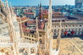 Top view from roof of famous Duomo di Milano Cathedral of White marble statues and Royal Palace Palazzo Reale Royalty Free Stock Photo