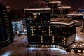 Top view of the roof of night newly built business center inmodern residential quarter with futuristic illumination.