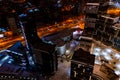 Top view of the roof of night newly built business center inmodern residential quarter with futuristic illumination.