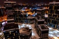 Top view of the roof of night newly built business center inmodern residential quarter with futuristic illumination.