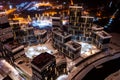 Top view of the roof of night newly built business center inmodern residential quarter with futuristic illumination.