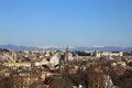 Top view of the rooftops and churches of Rome, Italy, on a cold winter day with snow capped white mountains Royalty Free Stock Photo