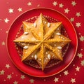 Top view of Roscon de reyes on a red plate with golden stars. Kings day concept spanish three kings cake