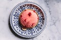 Top view of Rose and Lychee Mousses Cake decorated with rose petals in blue and white porcelain plate on marble background Royalty Free Stock Photo