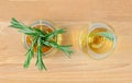 Top view of rosemary tea in glass cups on wooden table
