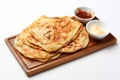 Top View, Roti Canai On A Wooden Boardon White Background