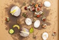 Top view of rotten food leftovers on soiled cardboard. Rotten fruit, vegetables and eggshells thrown for composting. Food waste