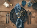 Top View Of Round Black Ceramic Plate With Blue Napkins And Silver Cutlery For Modern Boho Wedding Table Setting, AI Generated Royalty Free Stock Photo