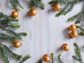 Top View Of Rounded Fir Frame With Golden Balls On A Light Wooden Background. The Basis For An Invitation Or Greeting Card.