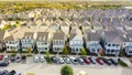 Aerial view row of upscale cottage style homes with parked cars on street near historic Old Town Coppell, Texas, USA Royalty Free Stock Photo