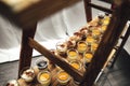Top view rows of glasses with various sweet vanilla of fruit dessert on wooden stand. Celebration, party, birthday or