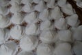 Top view of rows of woven panama hats before shaped or dyed, hat making, Montecristi panama hat Royalty Free Stock Photo