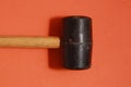 Top view of a rubber mallet isolated on an orange background Royalty Free Stock Photo