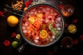 top view of rum punch, fruits, and ice in a large bowl Royalty Free Stock Photo