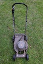 top view of a rusted broken electric lawnmower