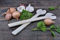 rustic arrangement with culinary condiment and wooden spoon on a plank