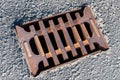 Top view of a rusty cast iron storm drain grate. Royalty Free Stock Photo