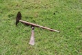 Top view, rusty old knife and hoe laying on lawn, gardening concept