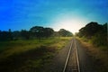 Top view of the rusty rails crossing the green field in a summer day , Northern Railway Thailand Royalty Free Stock Photo