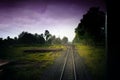 Top view of the rusty rails crossing the green field in a summer day , Northern Railway Thailand Royalty Free Stock Photo