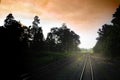 Top view of the rusty rails crossing the green field in a summer day , Northern Railway Thailand Royalty Free Stock Photo