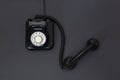 Top view of 1960` s retro telephone isolated on a black background. Space for text