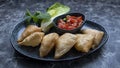 Samosa is a fried or baked pastry with a savory filling
