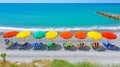 top view on the sandy beach sea tide, sun umbrellas, sun loungers