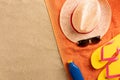 Top view of sandy beach with towel frame and summer accessories. Background with copy space and visible sand texture Royalty Free Stock Photo